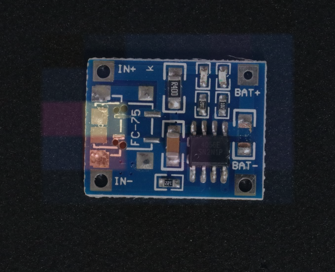 Semi-transparent PaDiM raw anomaly intensity over the governed PCB input